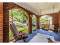 Cozy front porch featuring a swing and chairs, perfect for enjoying the neighborhood view at 1055 Woodland Se Ave, Atlanta, GA 30316
