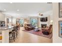 Open-concept living room with a fireplace and seamless flow to the kitchen at 2920 Farmstead Way, Suwanee, GA 30024