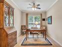 Bright office with a large window, wood floors, and a classic writing desk at 2920 Farmstead Way, Suwanee, GA 30024