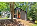 View of the home with its two-story design and contrasting brick and siding, next to neighboring house at 5115 Leland Dr, Stone Mountain, GA 30083
