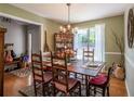 Inviting dining room with hardwood floors, natural light, and a classic chandelier at 1737 Mount Berry Dr, Douglasville, GA 30135