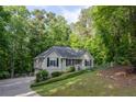 Attractive home featuring a well-kept yard, lush greenery, and inviting curb appeal at 1737 Mount Berry Dr, Douglasville, GA 30135