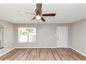 Bright living room featuring new hardwood floors, modern ceiling fan and natural light at 3170 Bellgreen Way, Decatur, GA 30032