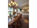 Elegant dining room with hardwood floors, a chandelier, and views of the updated kitchen at 1382 Fountain Lakes Drive Dr, Lawrenceville, GA 30043