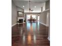 Spacious living room features a fireplace and is open to a dining area with gleaming hardwood floors at 1382 Fountain Lakes Drive Dr, Lawrenceville, GA 30043