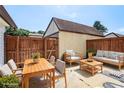 Enjoy the outdoor in this backyard patio with dining and seating areas, perfect for entertaining guests at 3210 Quincetree Lane Ln, Decatur, GA 30034