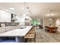 Spacious open-concept kitchen and dining area with an island, modern appliances, and lots of natural light at 2786 Overlook Ne Dr, Atlanta, GA 30345