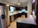 Updated kitchen features stainless steel appliances and granite countertops at 4191 Alaina Cir, Austell, GA 30106
