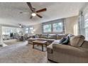 Open living room is cozy and features natural light at 543 S Holly Springs Rd, Woodstock, GA 30188