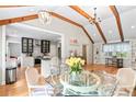 Inviting dining area with hardwood floors, exposed beams, and chandelier at 1359 Scott Blvd, Decatur, GA 30030
