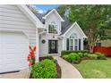 Beautiful home featuring a well-maintained lawn and garden leading to a welcoming front entrance at 5355 Wyntree Ct, Peachtree Corners, GA 30071