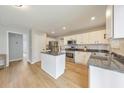 Modern kitchen featuring stainless steel appliances, white cabinets, granite countertops, and a center island at 3816 Harris Nw Blvd, Kennesaw, GA 30144