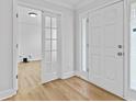 Inviting foyer with hardwood flooring, complemented by a view into an adjacent office space at 1897 Alcovy Trace Way Way, Lawrenceville, GA 30045