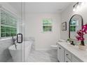 Contemporary bathroom featuring a soaking tub, glass shower, and marble floors at 2701 Windsor Nw Ct, Kennesaw, GA 30144
