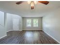 Bright living room features luxury vinyl plank flooring and a soaring ceiling at 7250 Old Chapel, Atlanta, GA 30349