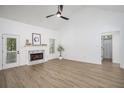 Bright living room with vaulted ceilings, fireplace, hardwood floors, and access to the outdoors at 6788 Oakhurst Court Ct, Douglasville, GA 30134
