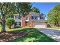 Beautiful two-story home with brick facade, and well-manicured front lawn at 11 Trotters Ne Walk, Cartersville, GA 30121