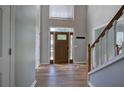 Inviting front foyer with a wood door, sidelights, and wood-look flooring at 11 Trotters Ne Walk, Cartersville, GA 30121