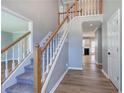 View of the carpeted staircase, white trim and wood floors at 11 Trotters Ne Walk, Cartersville, GA 30121