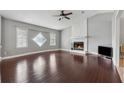 Open living room with hardwood floors, fireplace, and vaulted ceilings at 185 Hickory View Dr, Lawrenceville, GA 30046