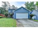 Charming two-story home with a well-manicured lawn and a two car garage in a desirable neighborhood at 200 Mona Ct, Lawrenceville, GA 30044
