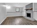 Finished basement with cozy fireplace and wood floors at 3429 Timbercreek Dr, Lawrenceville, GA 30044