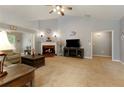 Cozy living room with a brick fireplace, vaulted ceilings, and comfortable seating at 175 Prince Ct, Hiram, GA 30141