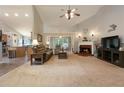 Spacious living room with a fireplace, vaulted ceilings, and neutral carpeting at 175 Prince Ct, Hiram, GA 30141