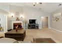 Bright living room with a fireplace, neutral carpet, and plenty of natural light at 175 Prince Ct, Hiram, GA 30141