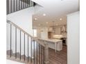 Open concept kitchen with white shaker cabinets, stainless appliances, and a large center island at 816 Dodd S Trl # 172, Buford, GA 30518