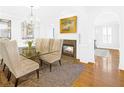 Bright dining room with chandelier and a fireplace, offering a blend of sophistication and warmth at 195 Mystic Ct, Atlanta, GA 30342