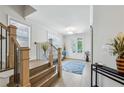 Upstairs hallway features wood floors, white walls, and natural lighting at 2059 Wheaton Way, Atlanta, GA 30328