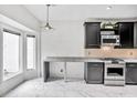 Eat-in kitchen features stainless appliances, stone countertops, and bright light from windows at 2983 Crosswycke Forest Dr, Brookhaven, GA 30319