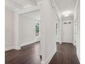 Bright foyer featuring dark wood floors, white walls, and a modern ceiling light fixture at 1158 Welch Sw St, Atlanta, GA 30310