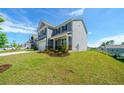 Two-story home featuring a well-manicured front lawn and landscaping at 4420 Merrigold Way, Fairburn, GA 30213
