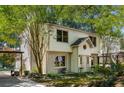 Charming two-story home with a brick foundation, a well-manicured lawn, and mature trees at 1071 Standard Ne Dr, Brookhaven, GA 30319