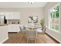Cozy breakfast nook with bright window and seating for four at 507 Huntgate Rd, Woodstock, GA 30189