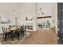 Open-concept dining room with fireplace and view of the living area at 507 Huntgate Rd, Woodstock, GA 30189