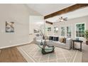 Bright living room with wood beams, many windows, and an open concept at 507 Huntgate Rd, Woodstock, GA 30189