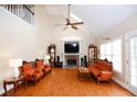 Spacious living room featuring high ceilings, fireplace, and a cozy seating area at 4000 Longlake Dr, Duluth, GA 30097