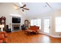 Bright living room with vaulted ceiling, fireplace, and hardwood floors at 4000 Longlake Dr, Duluth, GA 30097