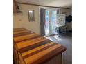 Kitchen showcasing butcher block countertops and double doors allowing an abundance of light into the space at 4282 By Pass, Loganville, GA 30052