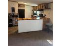 Cozy kitchen featuring custom butcher block countertops, neutral color palette, and modern appliances at 4282 By Pass, Loganville, GA 30052