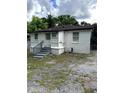 Rear view of a small home featuring a modest entrance and a fenced yard at 303 Anderson Nw Ave, Atlanta, GA 30314
