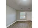 Bright living room boasts hardwood floors, neutral paint, and natural light at 1232 Pinedale Nw Cir, Conyers, GA 30012