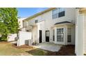 View of a private backyard area with a small patio and partial fence at 2727 Parkway Trl, Lithonia, GA 30058