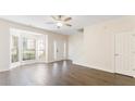 Spacious living room with hardwood floors and a bay window offering natural light at 2727 Parkway Trl, Lithonia, GA 30058