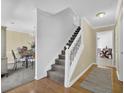 Inviting foyer with stairway and hardwood floors providing access to the dining room and another living space at 985 Laurel Springs Ln, Marietta, GA 30064
