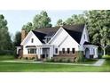 Beautiful two-story home with a brick and white siding exterior and covered front porch at 1049 Pine Bark Lane, Canton, GA 30114