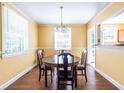 Cozy dining room with classic wooden table and chairs and bright natural light at 1268 Thomas Rd, Decatur, GA 30030